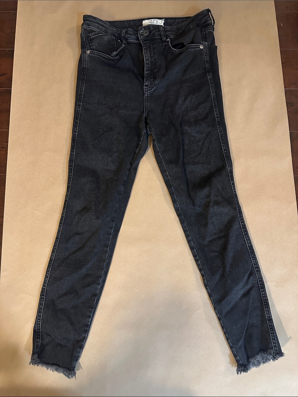 We The Free Washed Black Skinny Jeans with Frayed Ankles